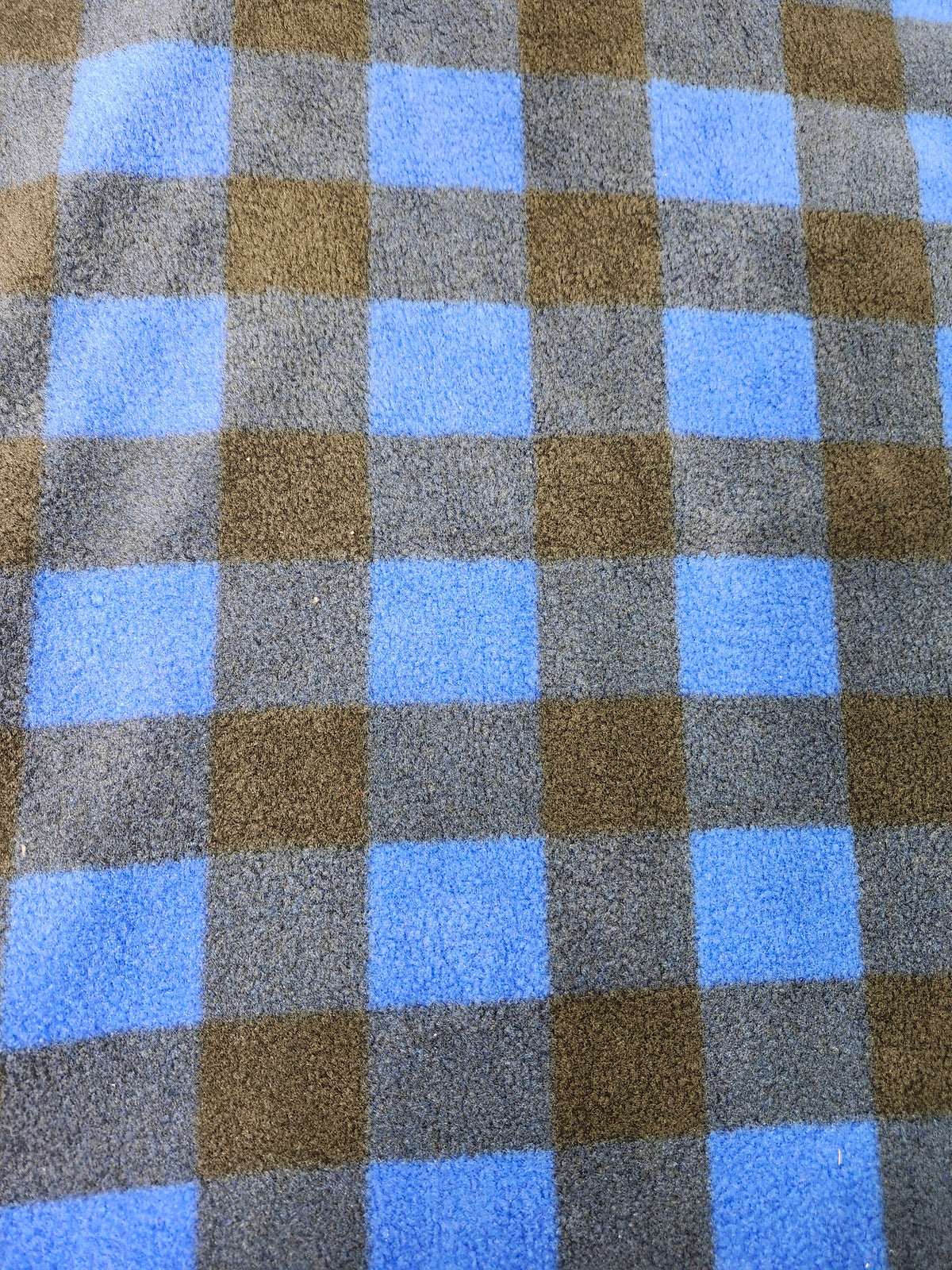 Plaid checkered polyester plaid fleece fabric with a soft brushed finish for blankets, apparel, and crafts