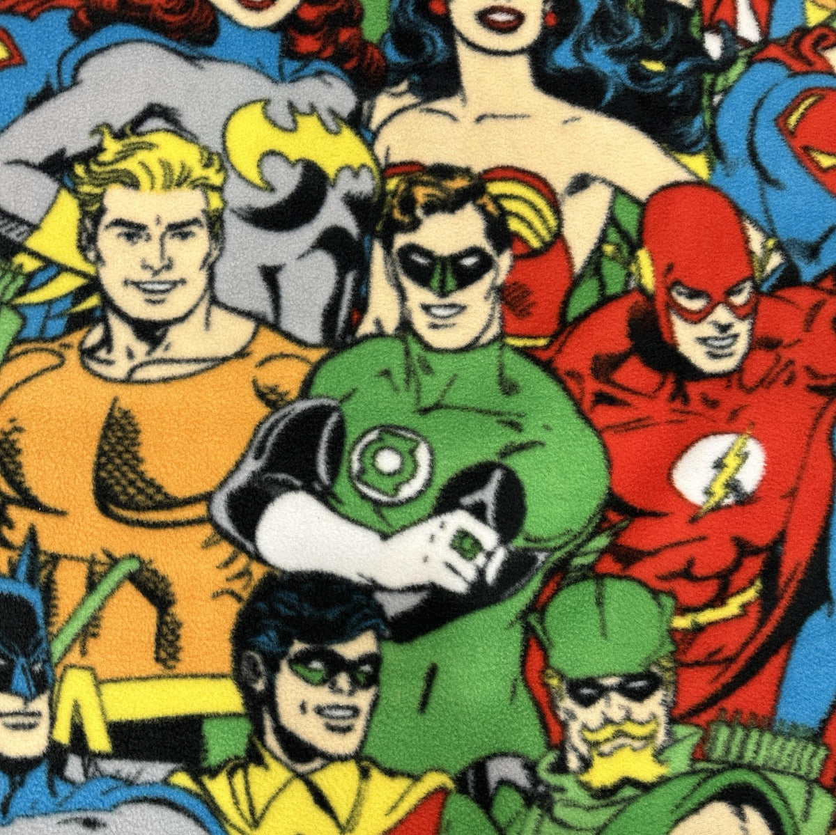 Multicolour DC Comics superheroes fleece fabric with a bold vintage comic-style character print