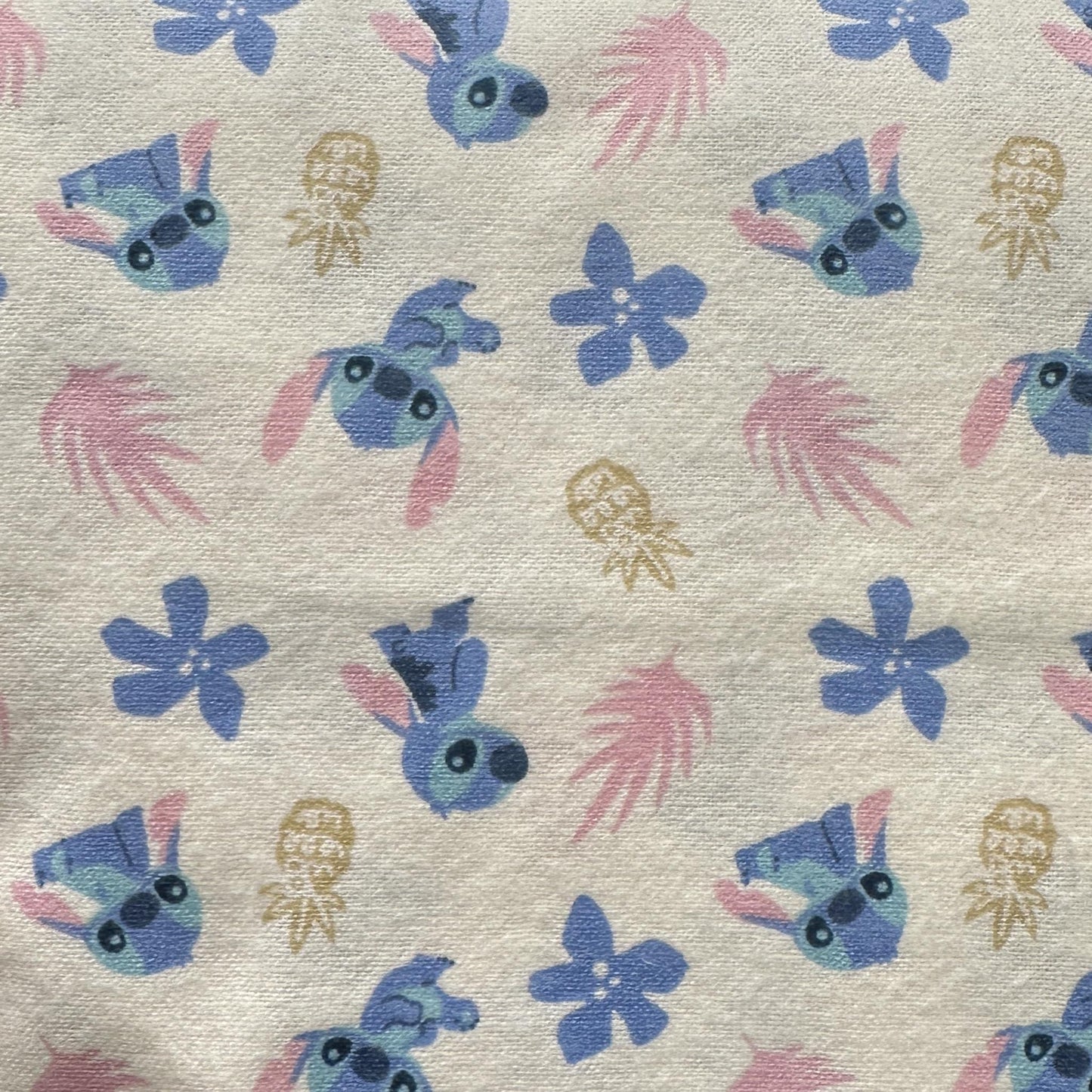 Beige Disney Lilo & Stitch cotton flannel fabric with Stitch and pineapple print