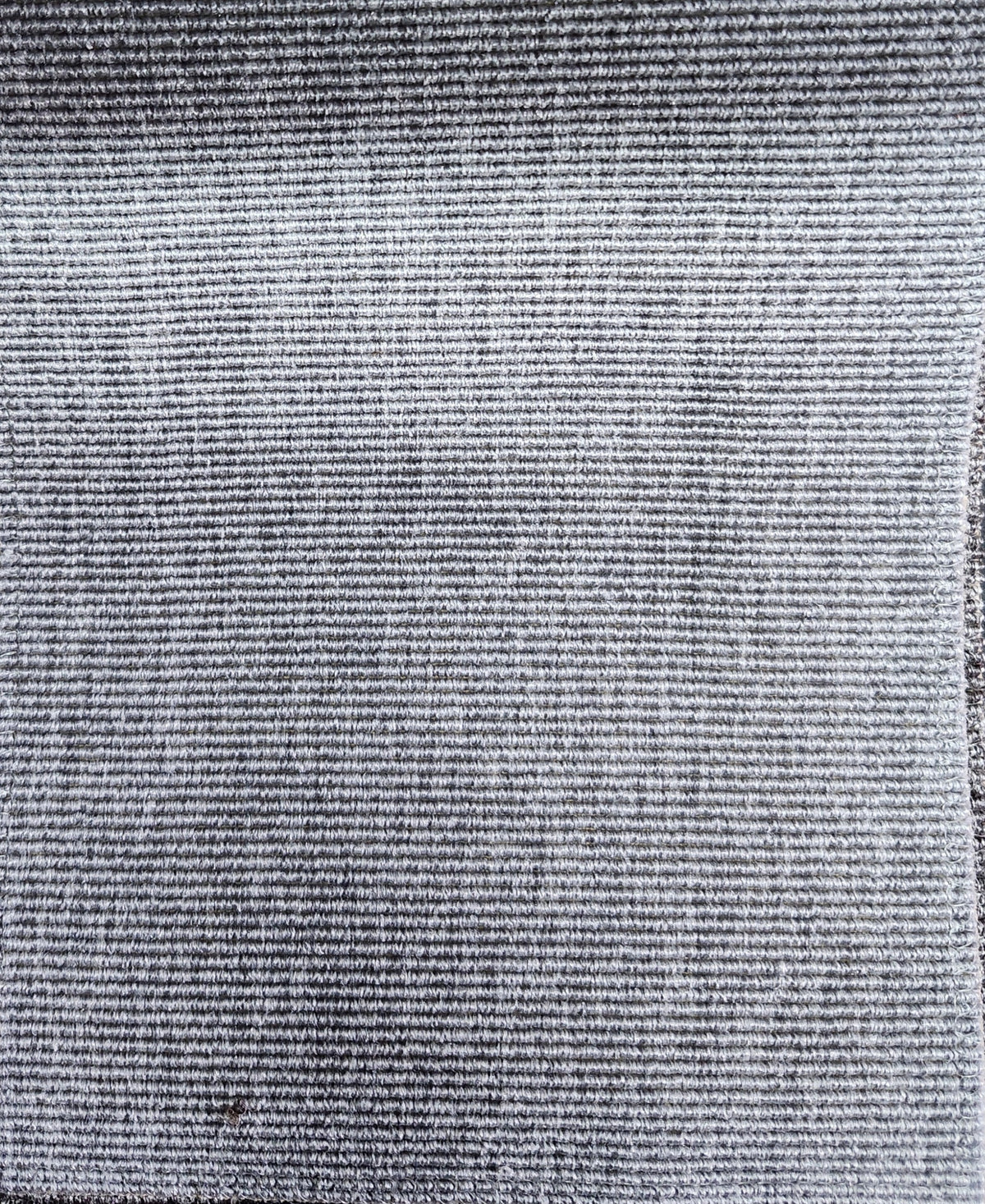 Solid black fire retardant polyester upholstery fabric with a durable woven texture