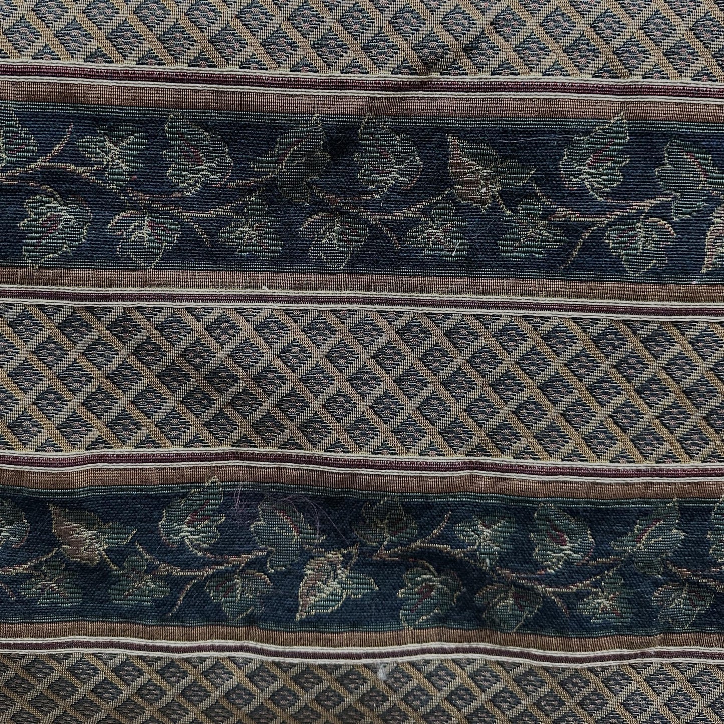 Vintage geometric leaf upholstery fabric with a repeating floral-inspired pattern