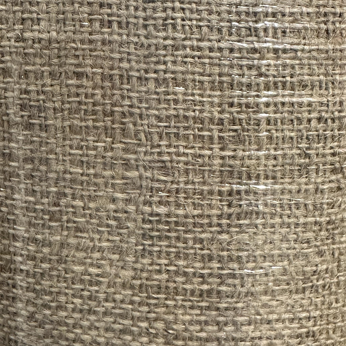 Natural burlap fabric with a coarse open weave and rustic textured appearance
