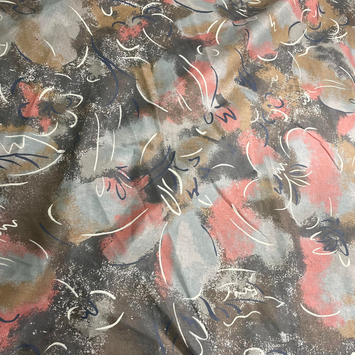Blue and pink 100% cotton fabric with a contemporary abstract printed pattern