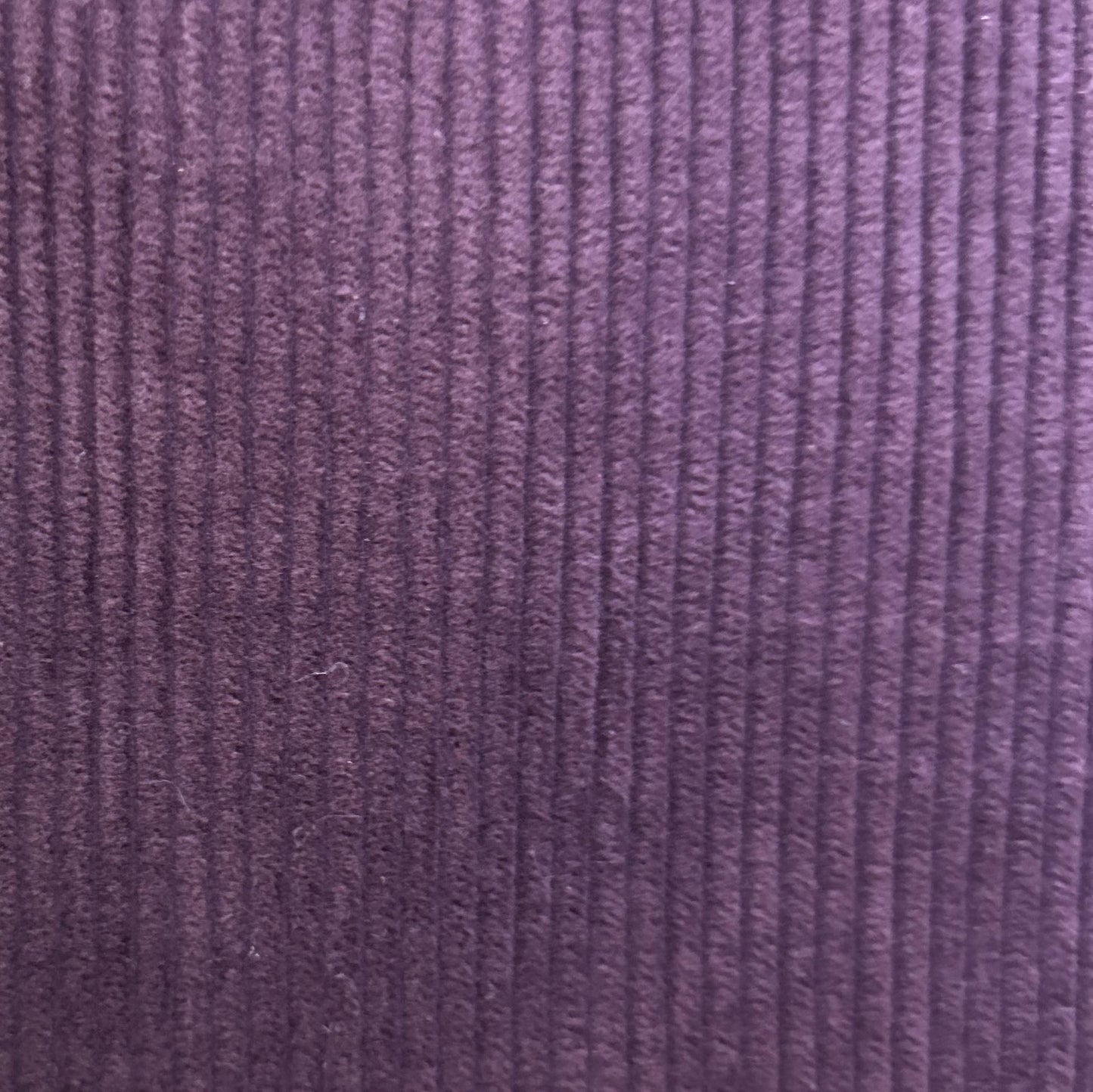 Purple velvet upholstery fabric with a soft ribbed corduroy look-a-like texture