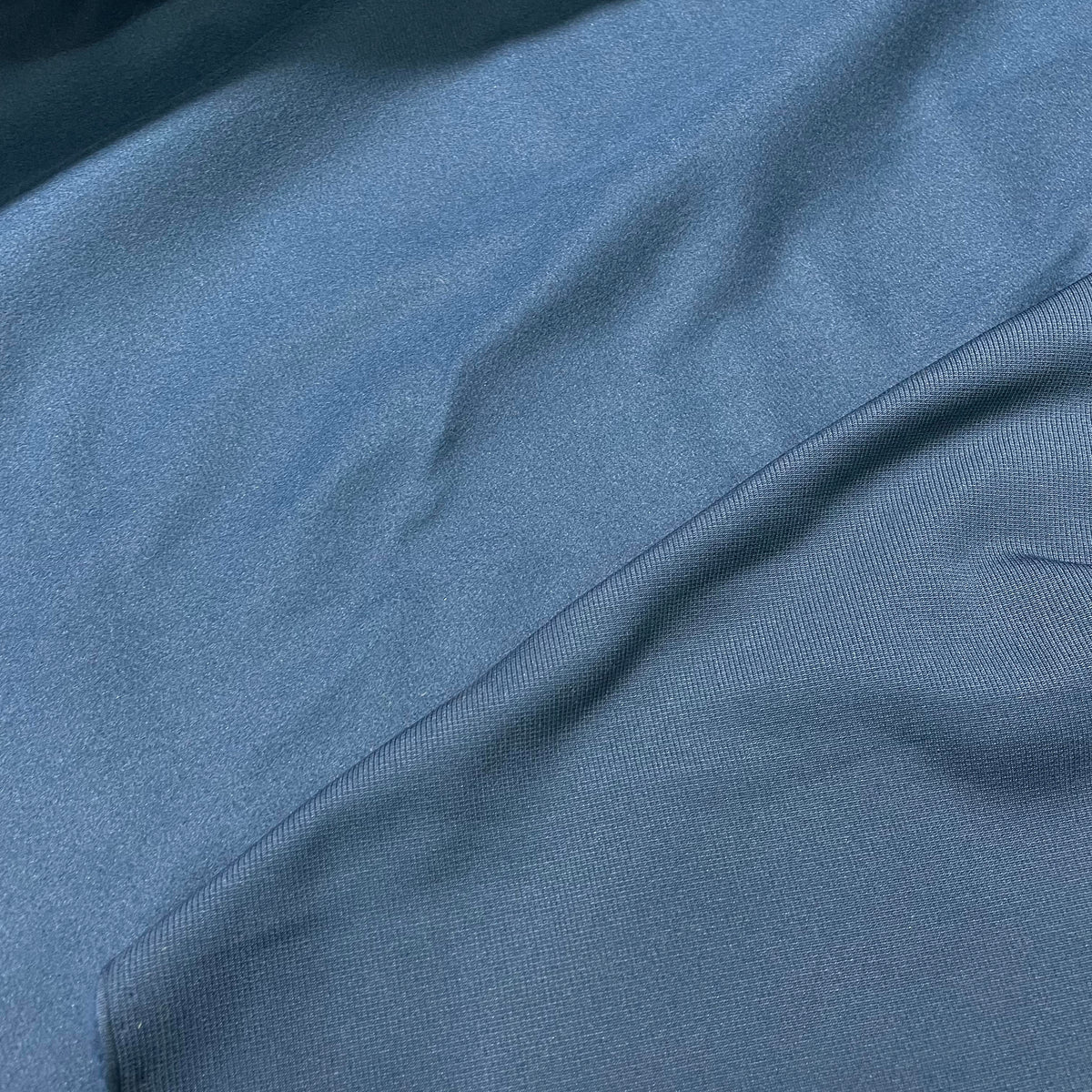 Solid dark navy blue stretch cotton hoodie fabric with a lightweight apparel-friendly appearance