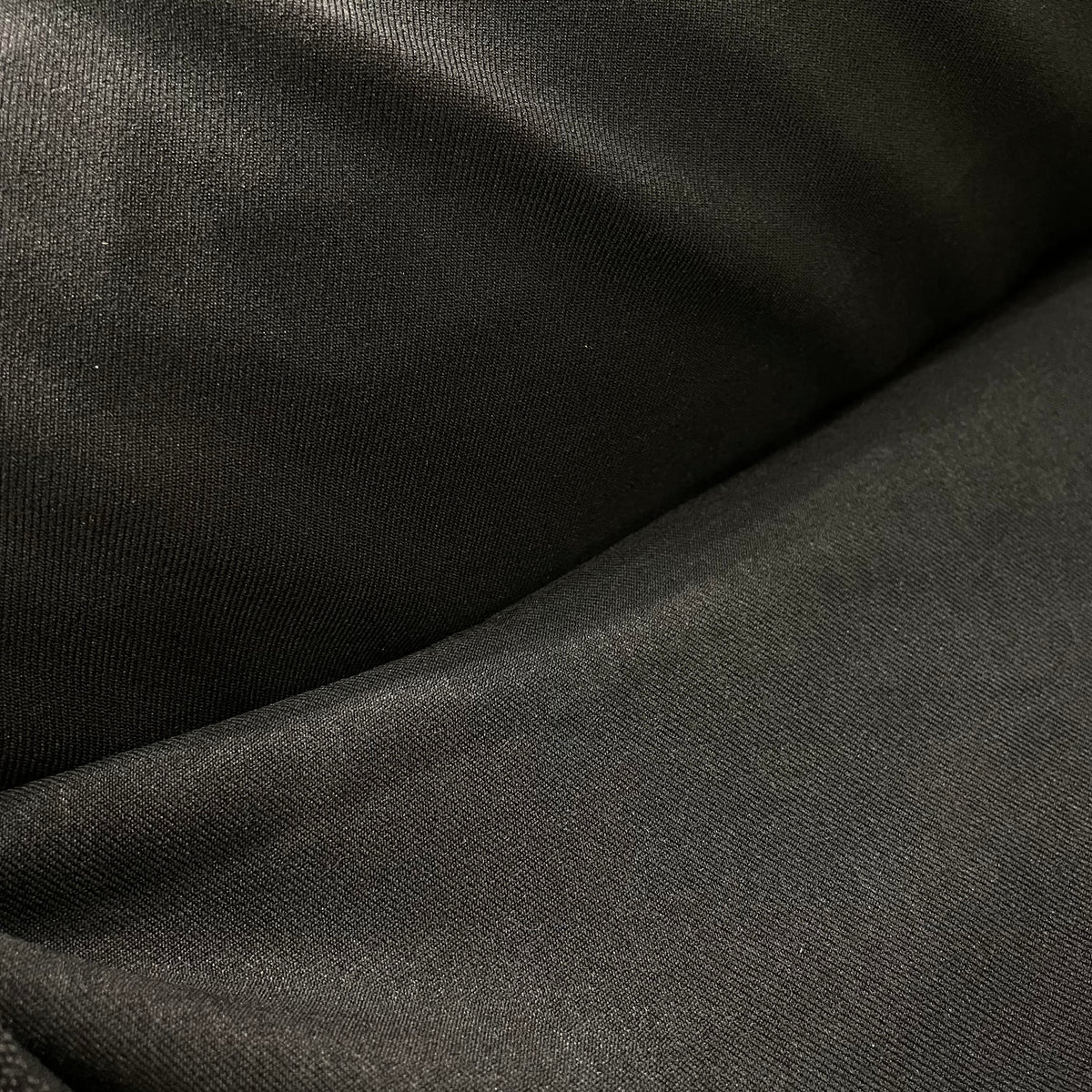 Dark brown stretch suiting fabric with a fine woven surface and solid colour