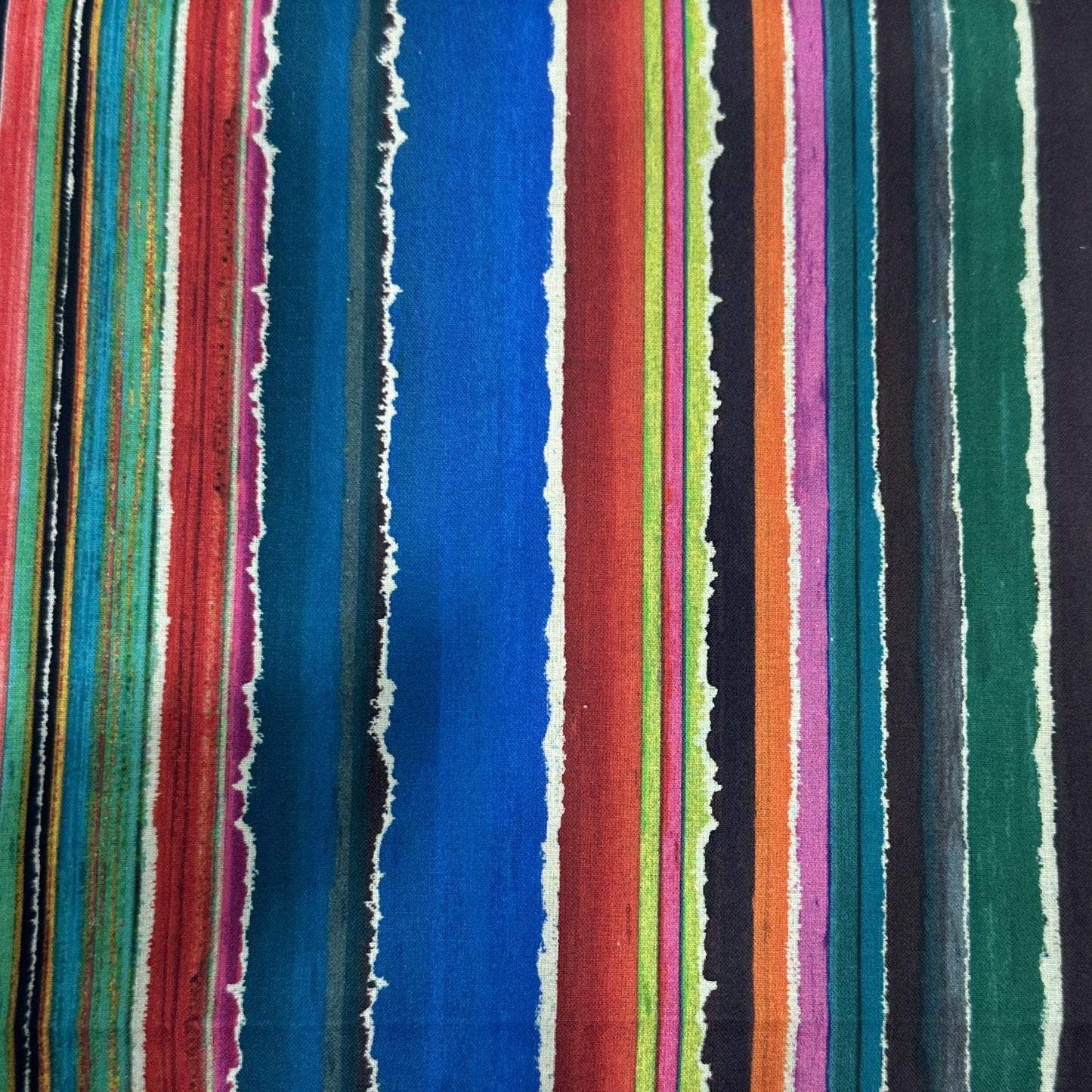 Colourful 100% cotton fabric with bright rainbow stripes for quilting and sewing