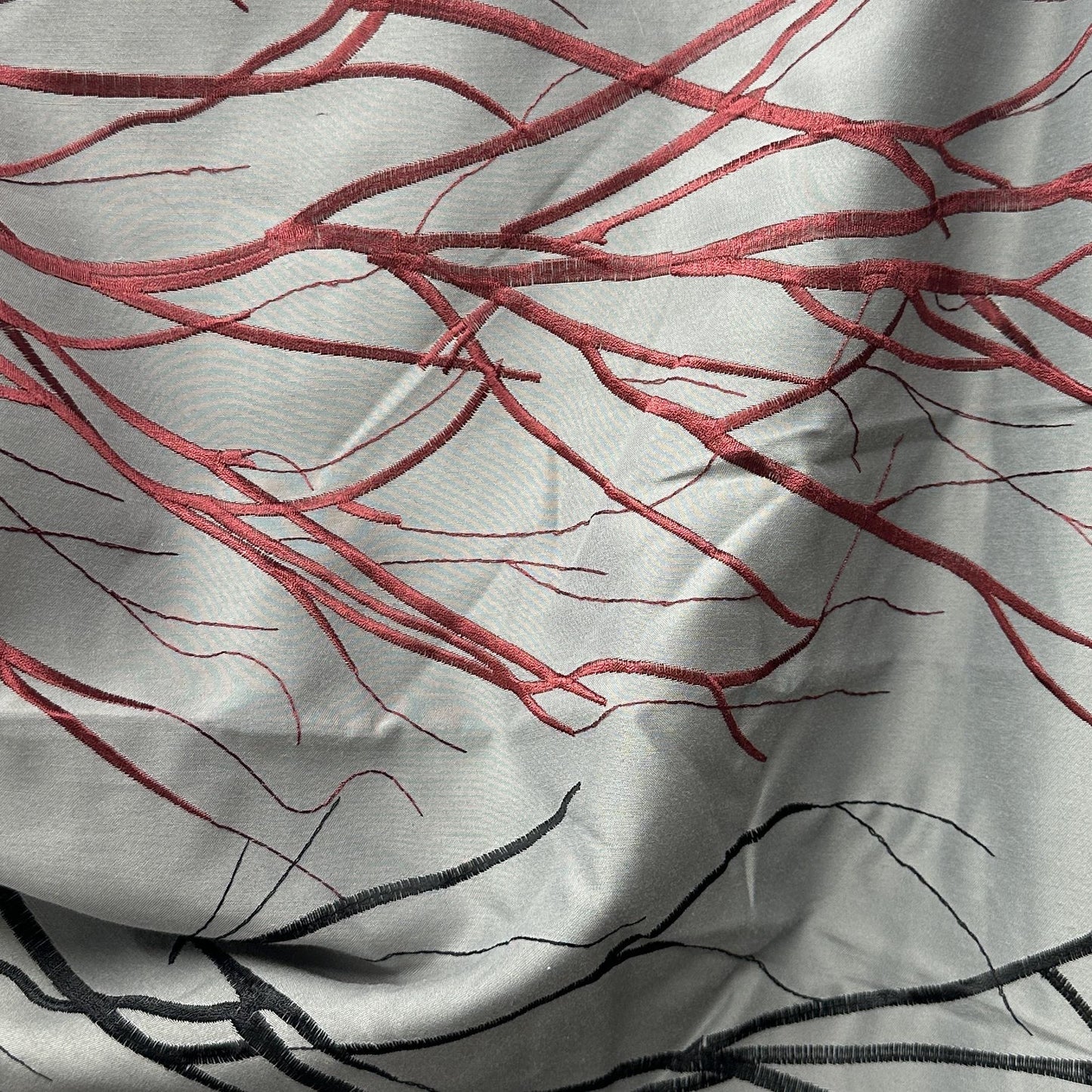 Silver grey and burgundy wide-width drapery fabric with a decorative branch pattern