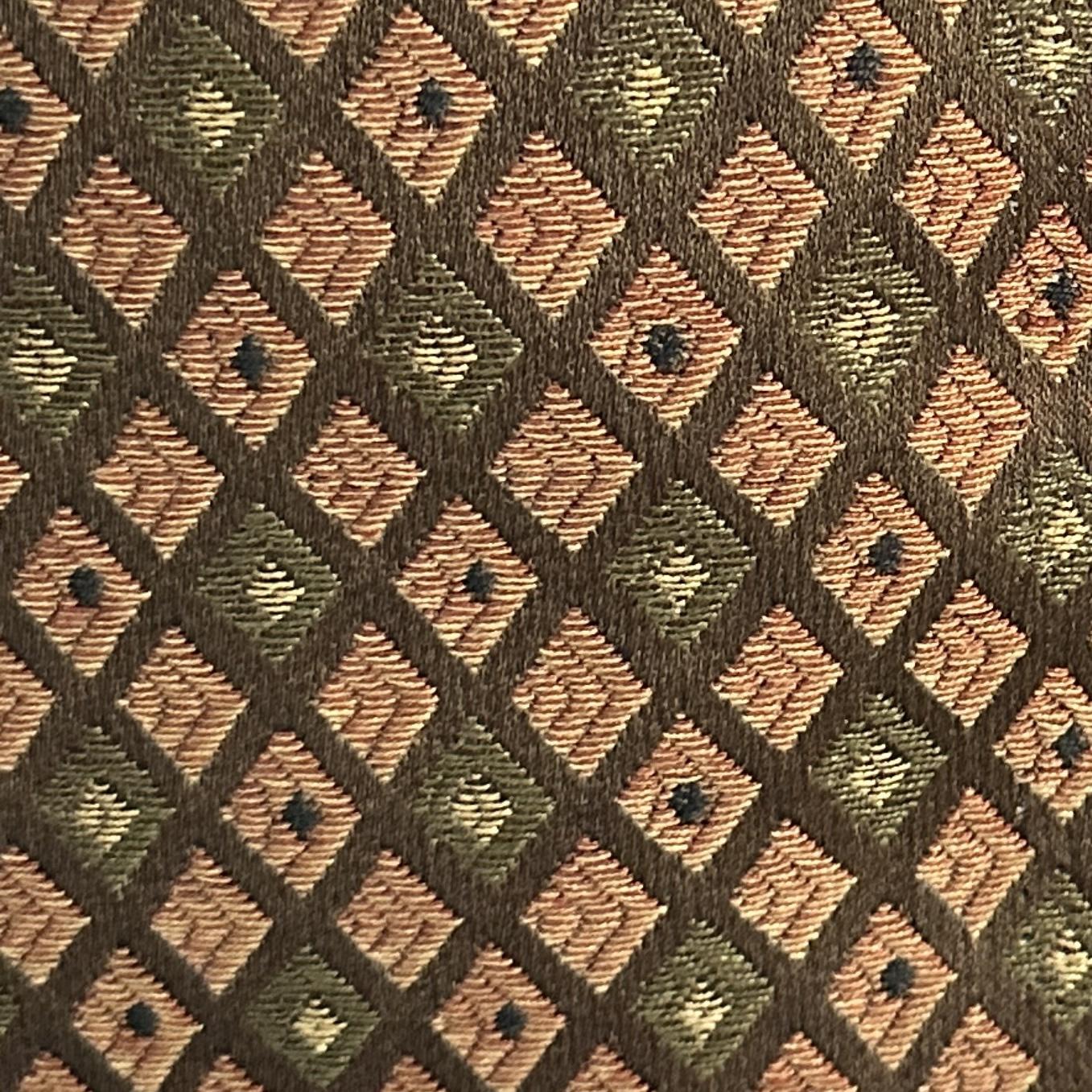 Green and red upholstery fabric with geometric rhombus pattern