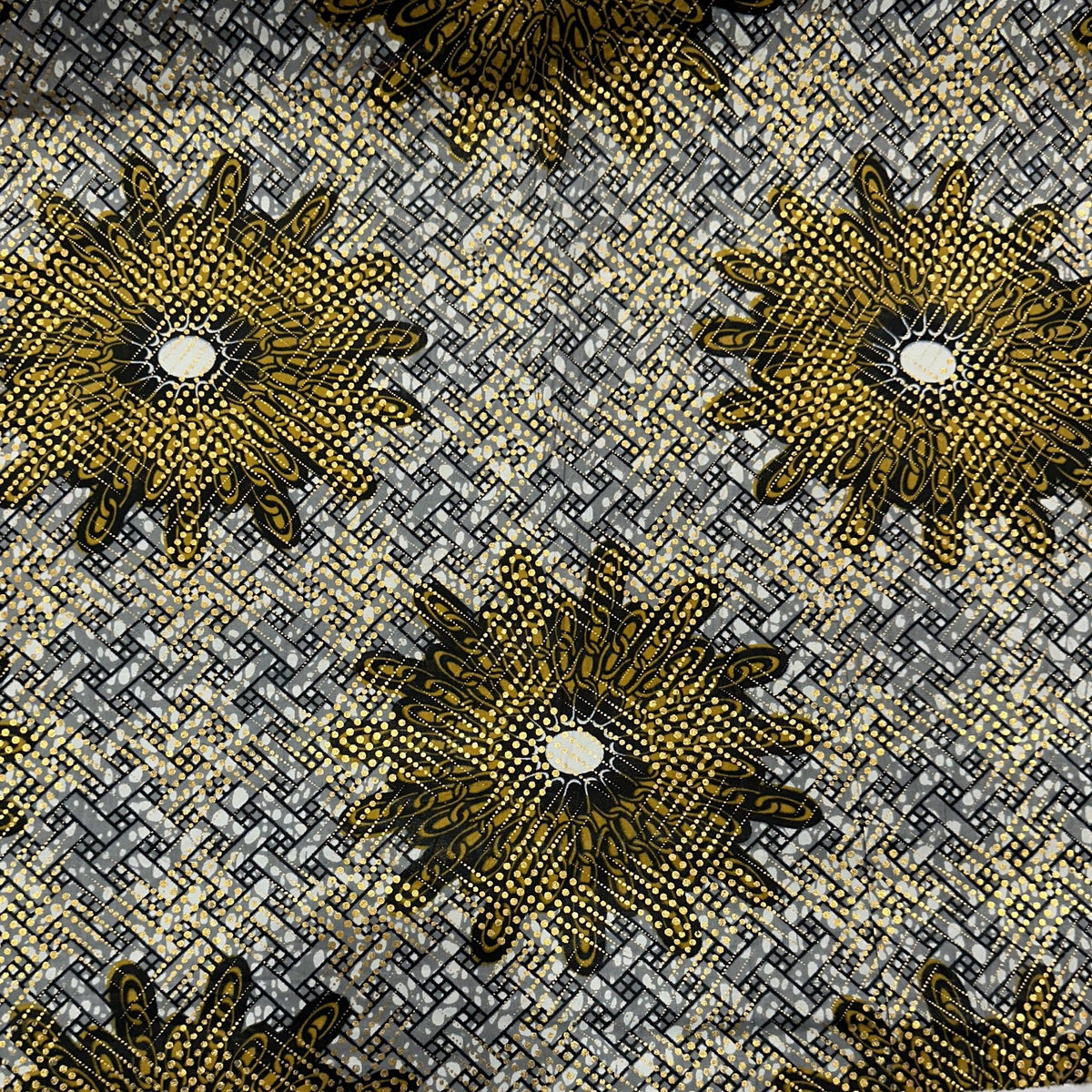 African wax cotton fabric with a colourful repeating geometric sun pattern
