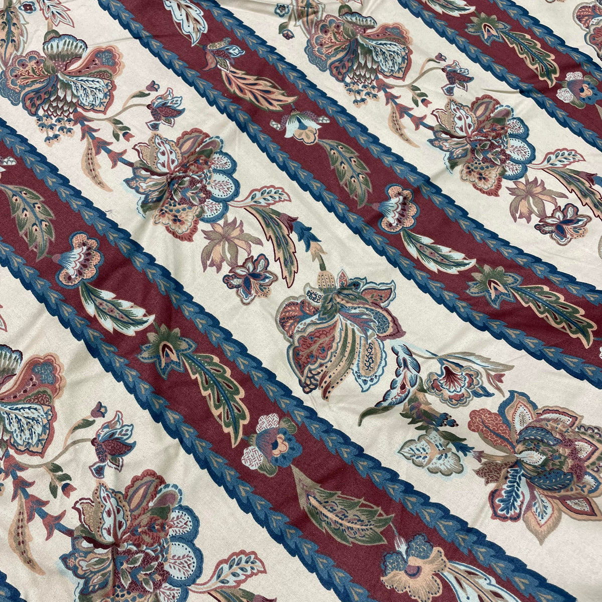 Cotton fabric with a decorative floral pattern and coordinating stripes