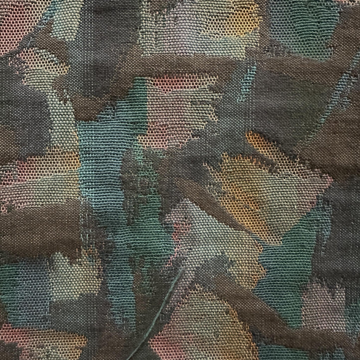 Multicolour polyester upholstery fabric with an abstract random brush pattern and denim-like woven texture
