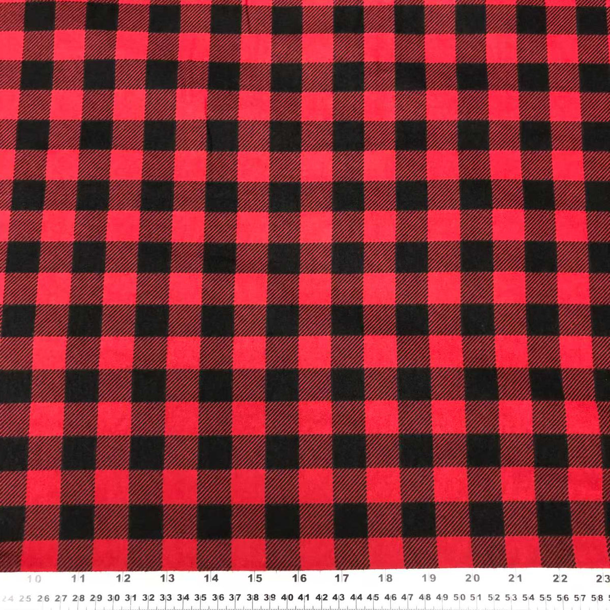 Red and black buffalo plaid cotton flannel fabric with a classic large check pattern
