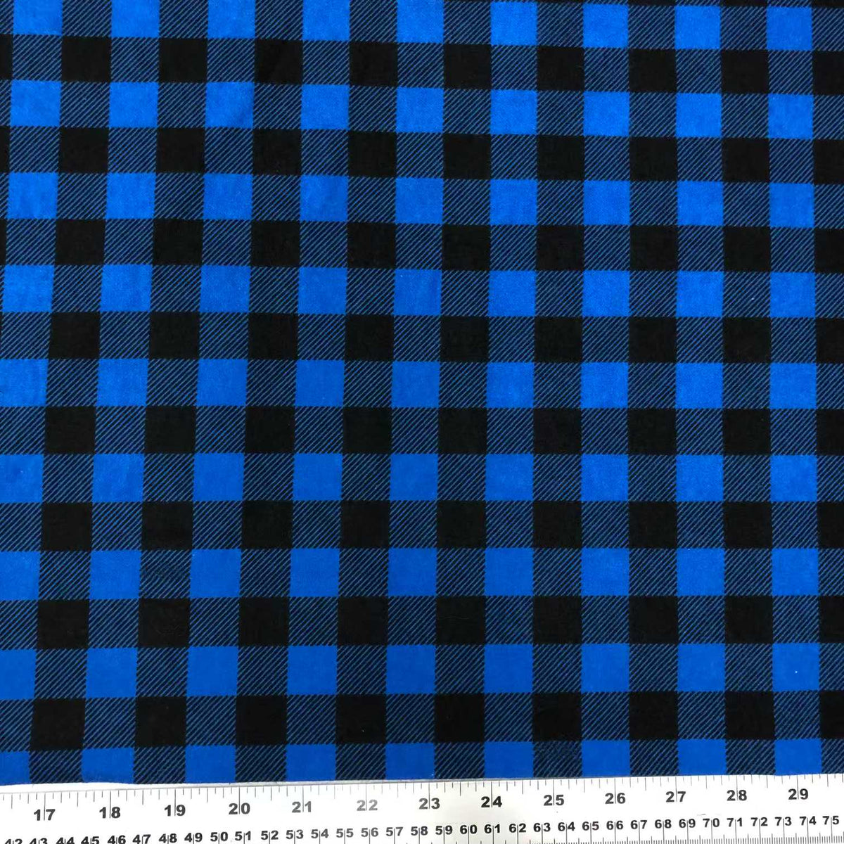 Blue and black cotton flannel fabric with a classic plaid check pattern