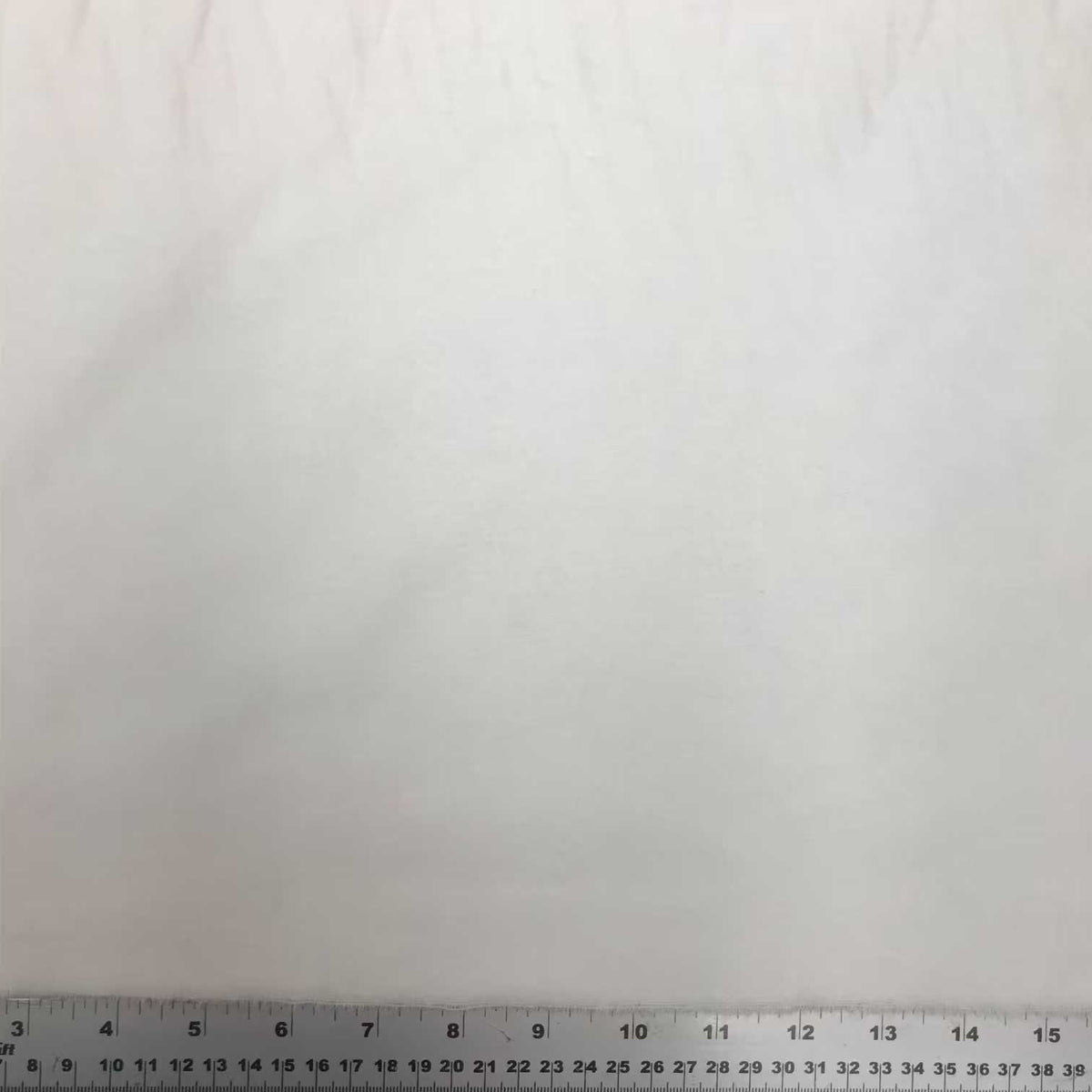 Solid white extra wide cotton flannel fabric with a soft, smooth flannelette surface