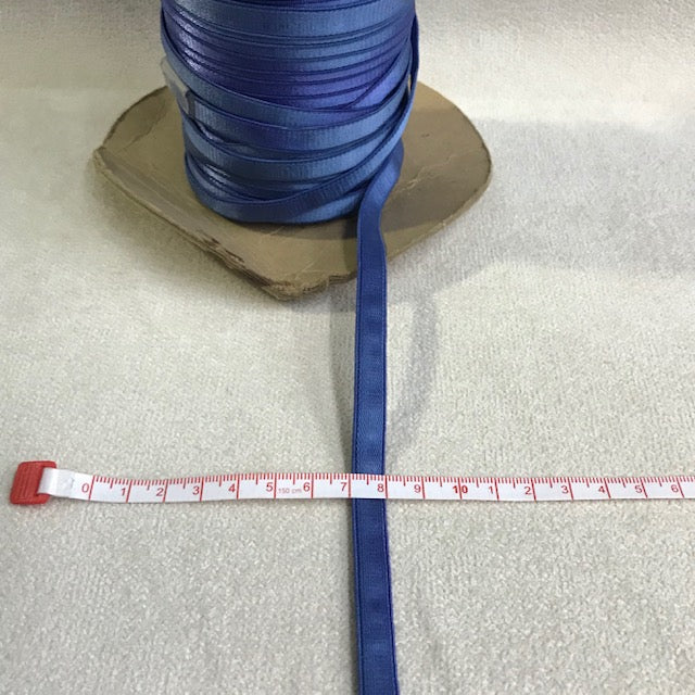 Blue 1 cm flat elastic trim with a narrow stretchy woven appearance