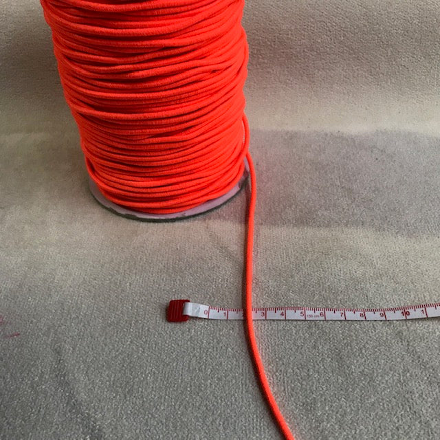 Bright orange 3 mm elastic cord trim with a narrow flexible construction