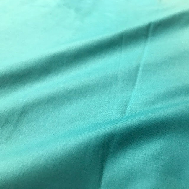 Solid Regatta teal cotton fabric with a smooth woven surface
