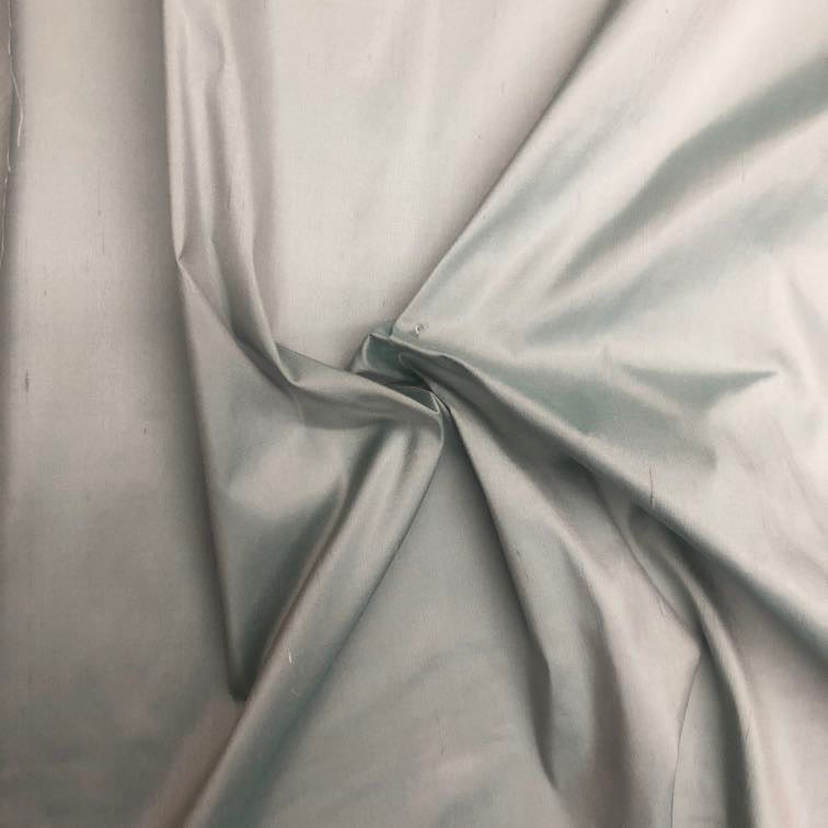 Dupioni silk fabric in light green with crisp textured finish