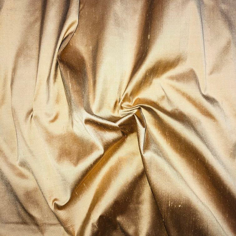 Dupioni silk fabric in melba gold with crisp textured finish