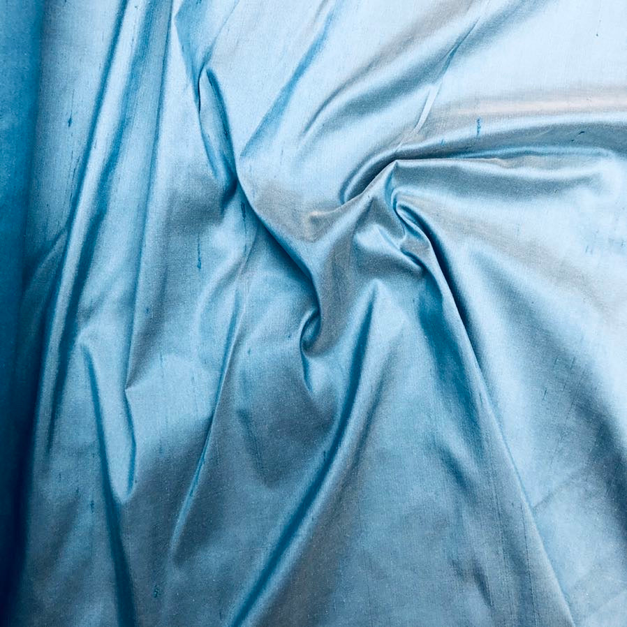 Dupioni silk fabric in noon sky blue with crisp textured finish