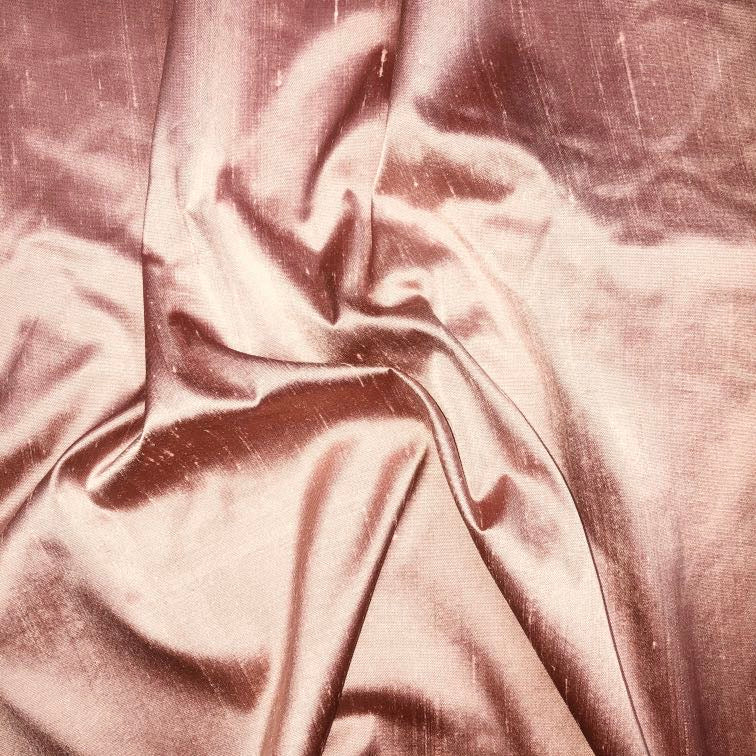 Dupioni silk fabric in rose pink with crisp textured finish