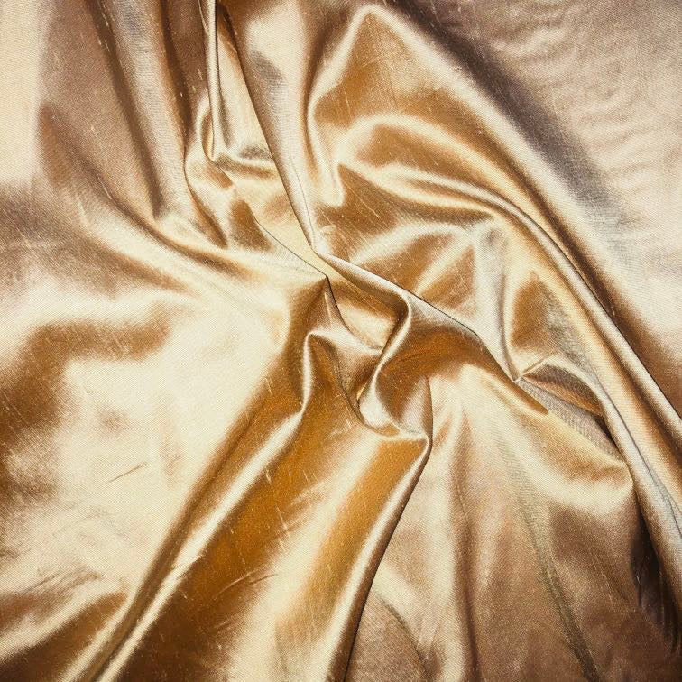 Dupioni silk fabric in melba gold with crisp textured finish