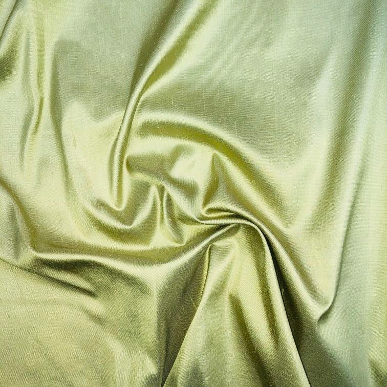 Dupioni silk fabric in seedling green with crisp textured finish