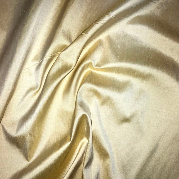 Dupioni silk fabric in stardust gold with crisp textured finish