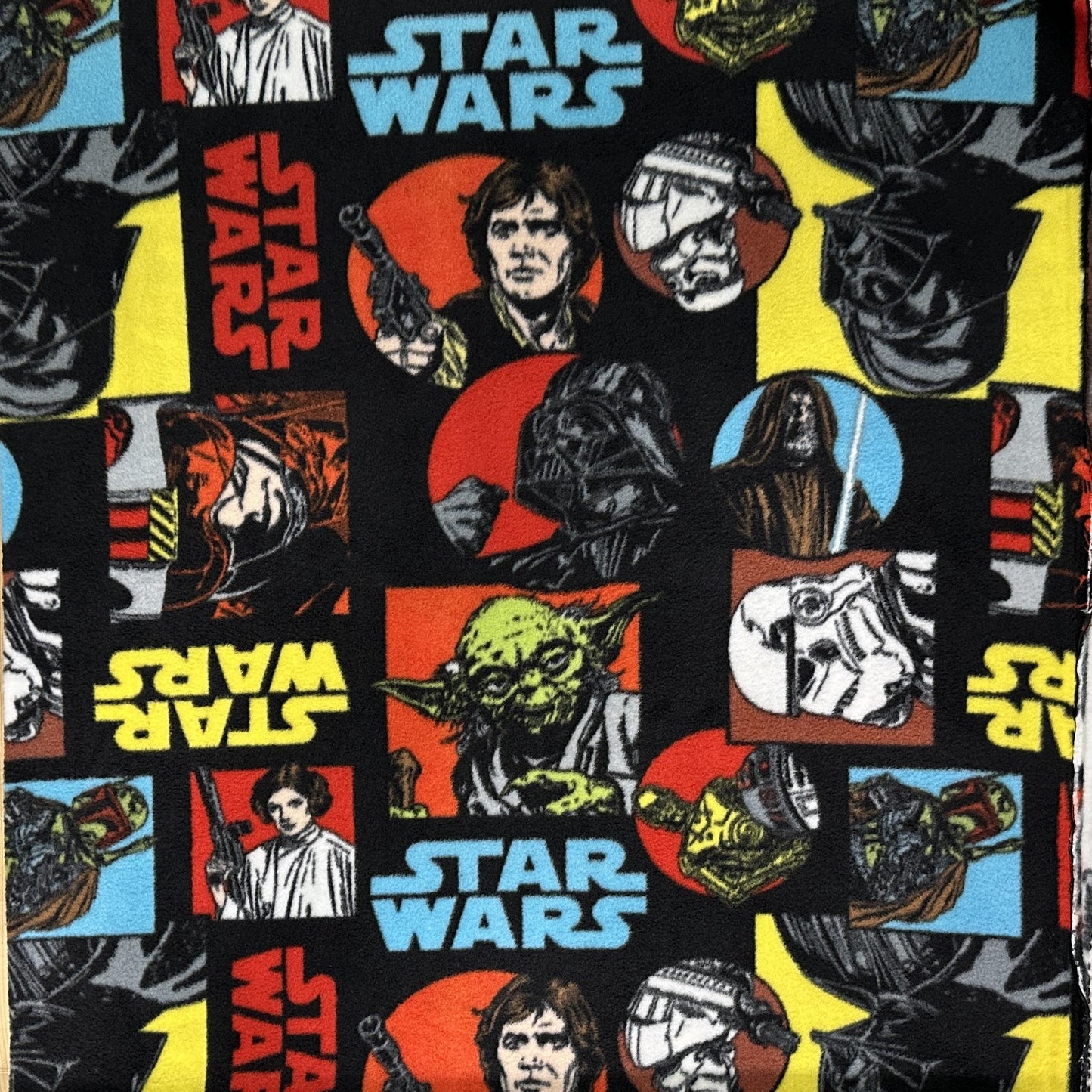 Black Star Wars fleece fabric featuring characters from the Original Trilogy