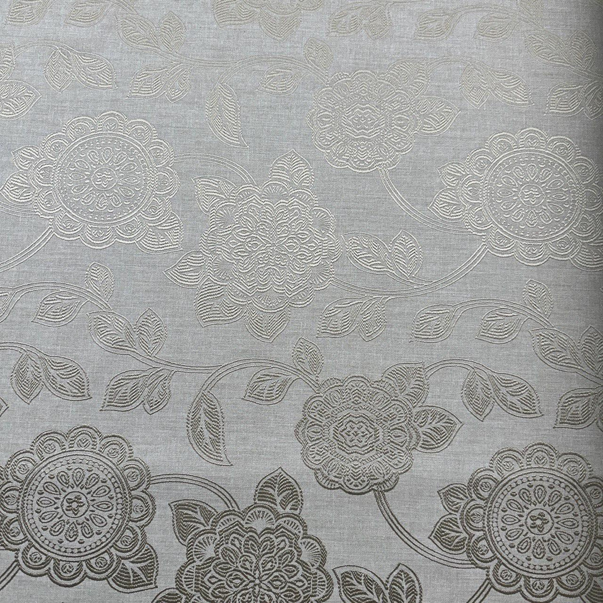 Gold upholstery fabric with a decorative floral pattern for furniture and home décor