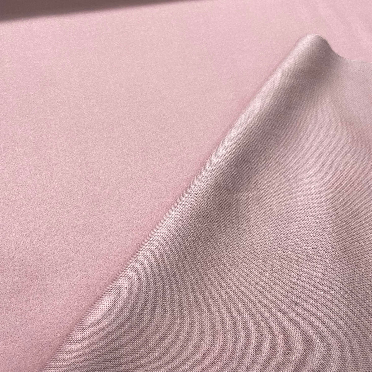 Solid pink purple stretch cotton hoodie fabric with a lightweight apparel-friendly appearance