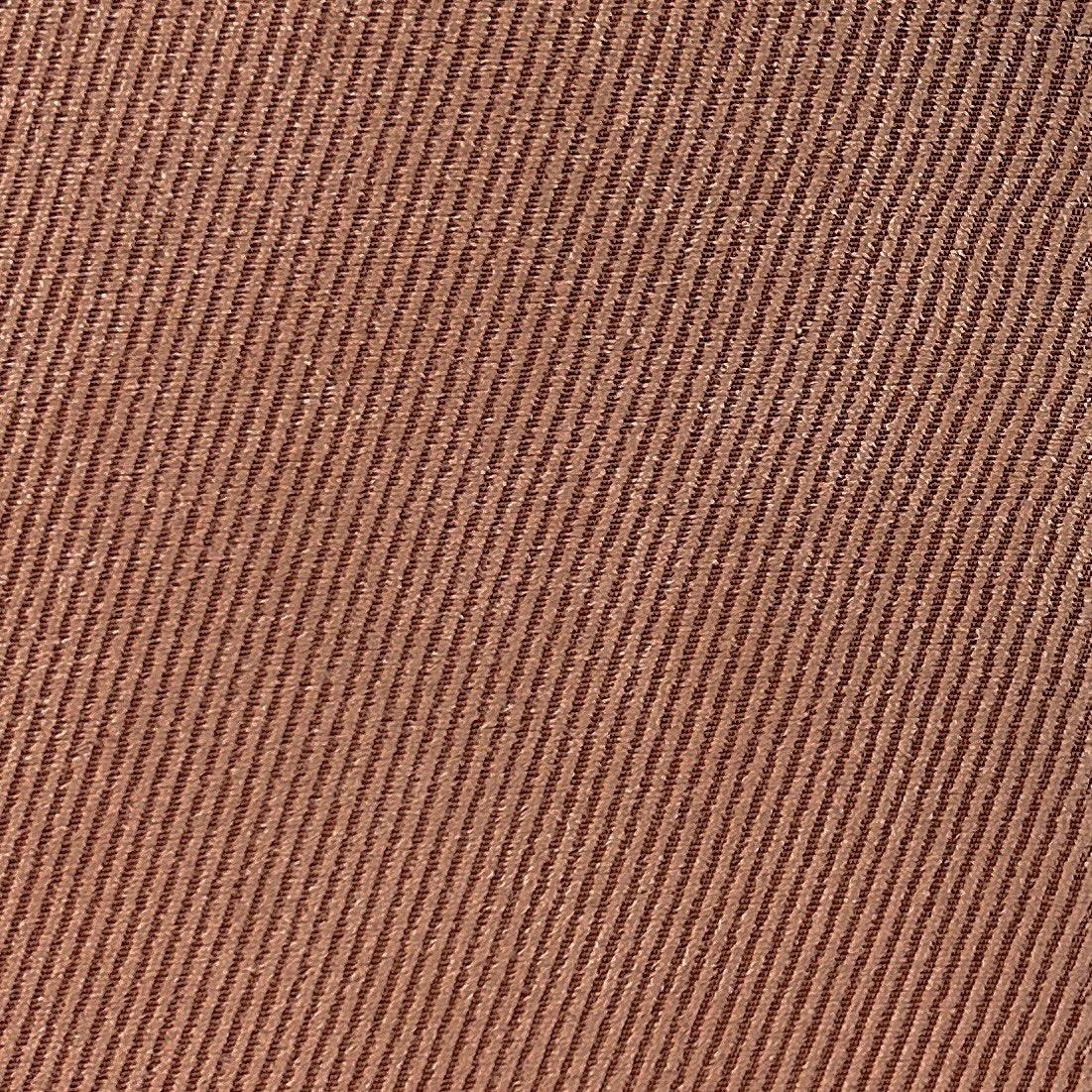 Coral red brown upholstery fabric with a textured lined surface