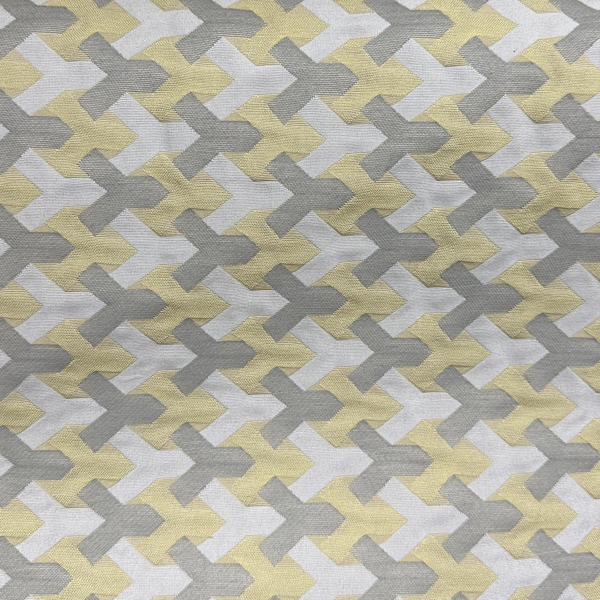 Yellow and grey upholstery fabric with an interlocking geometric illusion pattern