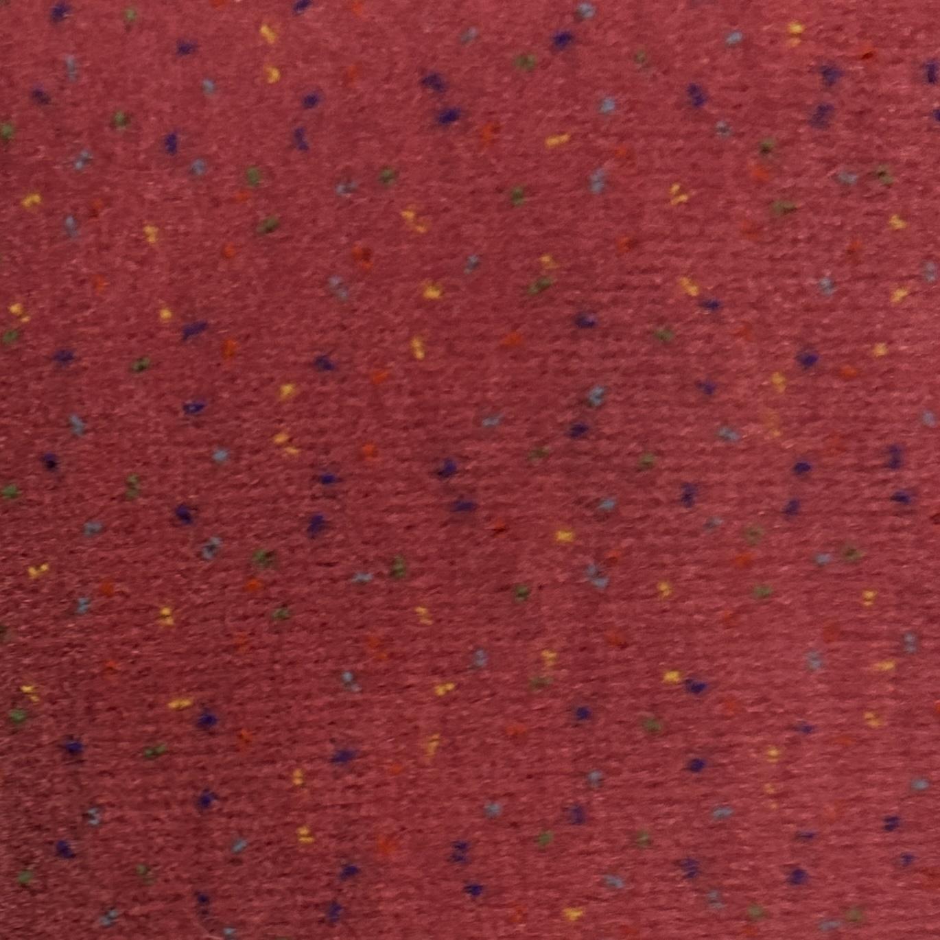 pink velvet upholstery fabric with small multicolour confetti flecks