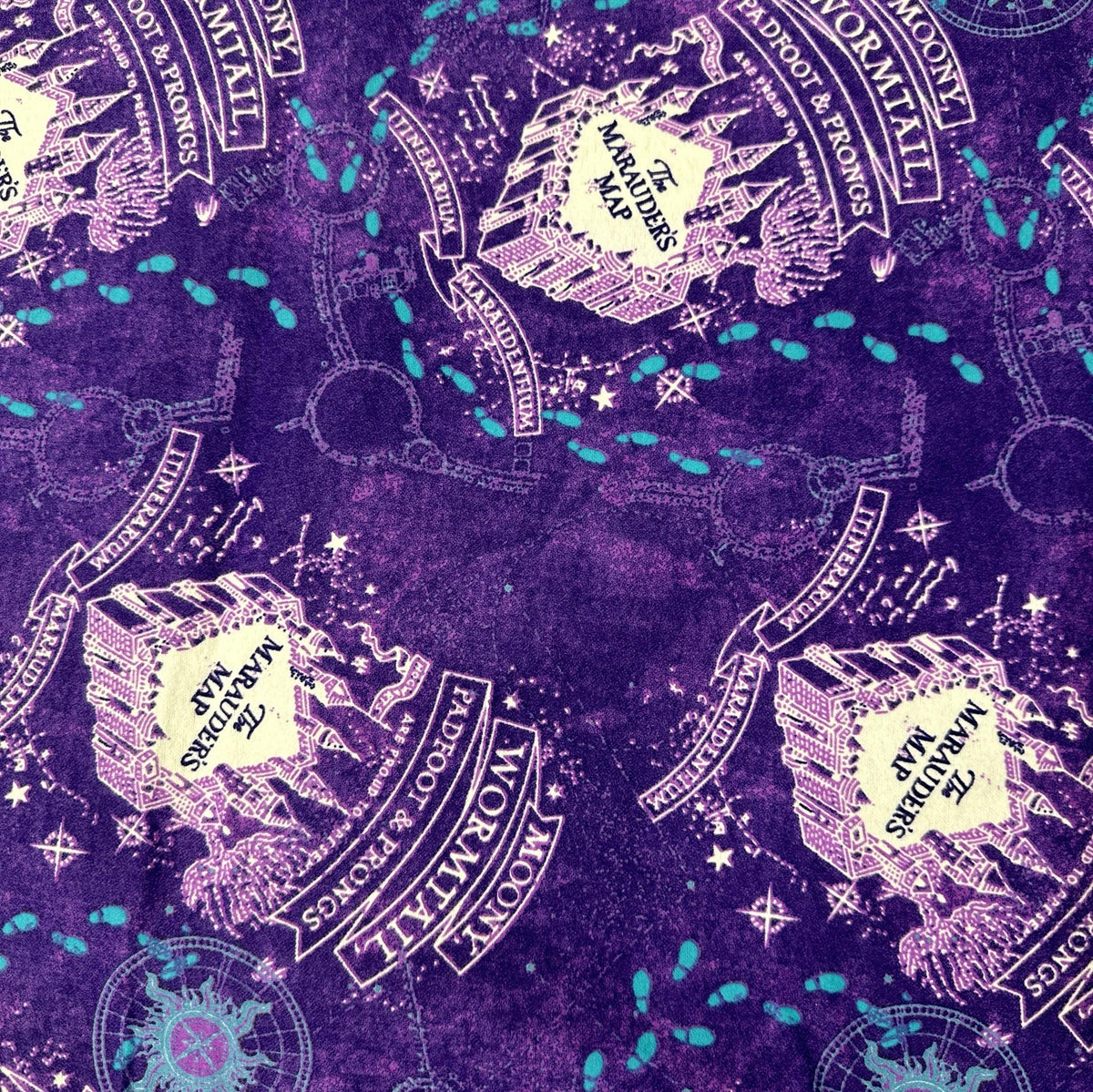 Purple Harry Potter flannel fabric with Marauder's Map graphics, footprints and castle illustrations