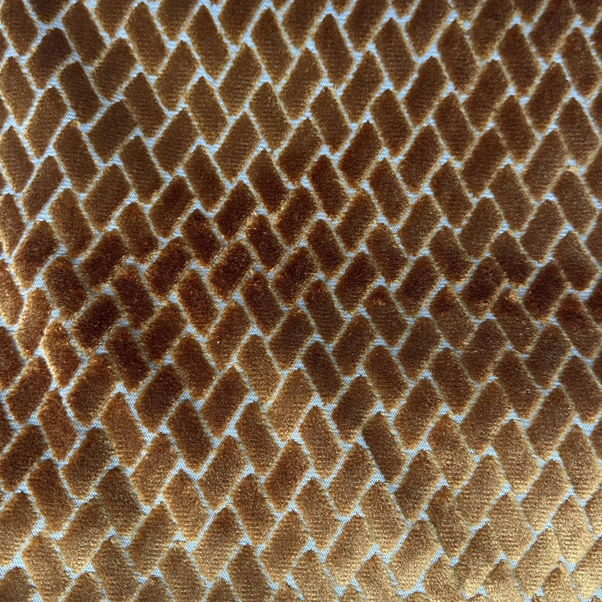 Bronze velvet upholstery fabric with raised irregular brick-like geometric shapes