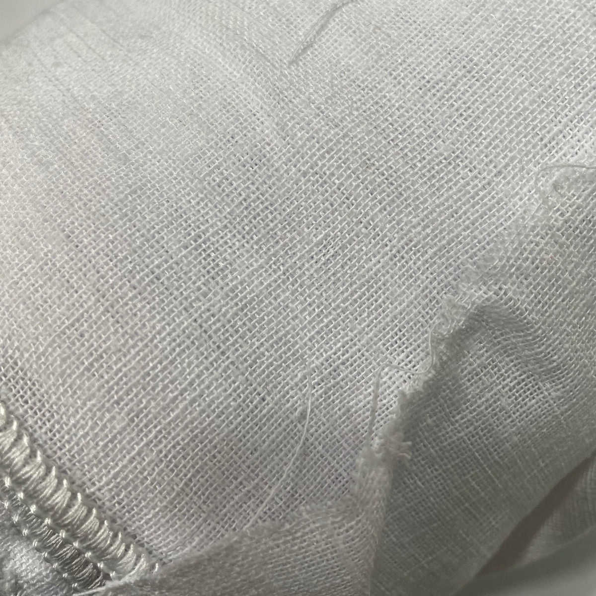 White extra-wide polyester sheer mesh fabric with a lightweight, semi-transparent appearance