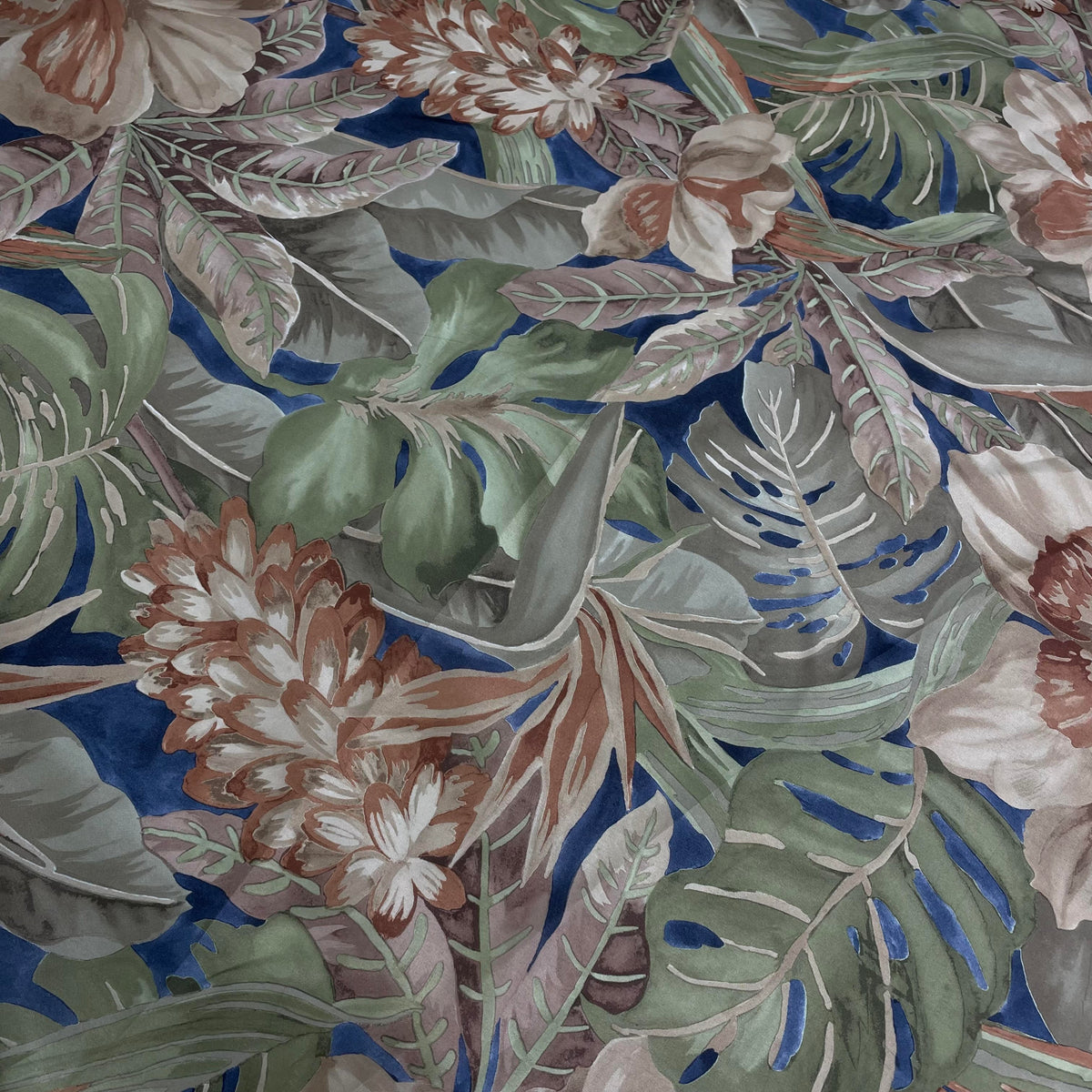 Green polyester fabric with a nature-inspired jungle botanical print