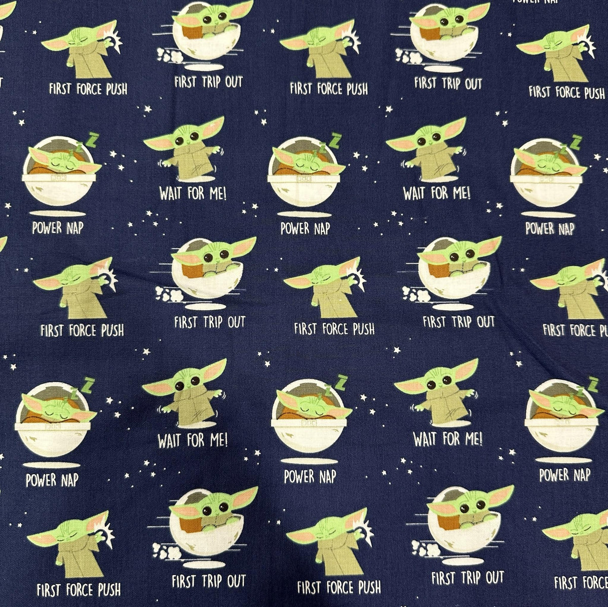 Blue and green Star Wars cotton fabric featuring Baby Yoda Grogu from The Mandalorian