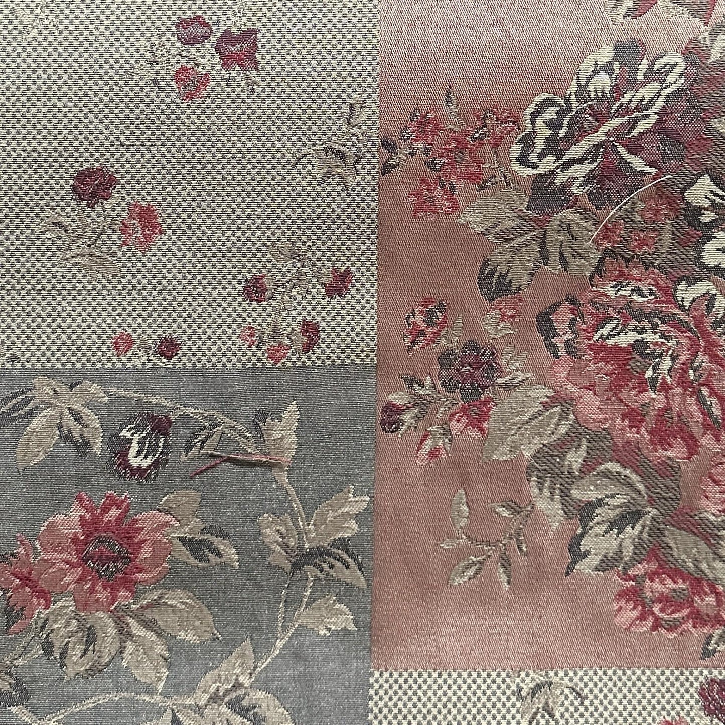 Colourful upholstery fabric with repeating floral blocks and geometric details