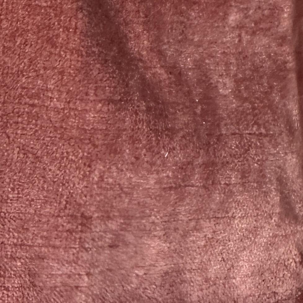 Solid brown velvet upholstery fabric with a soft, smooth pile and subtle tonal texture