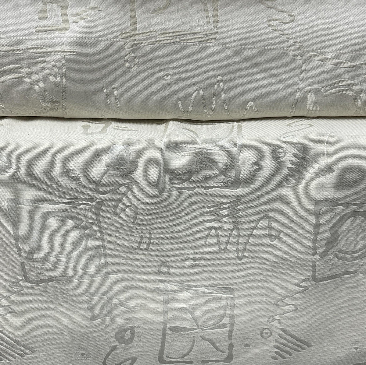 Contemporary light grey drapery fabric with a subtle patterned design for curtains and home décor