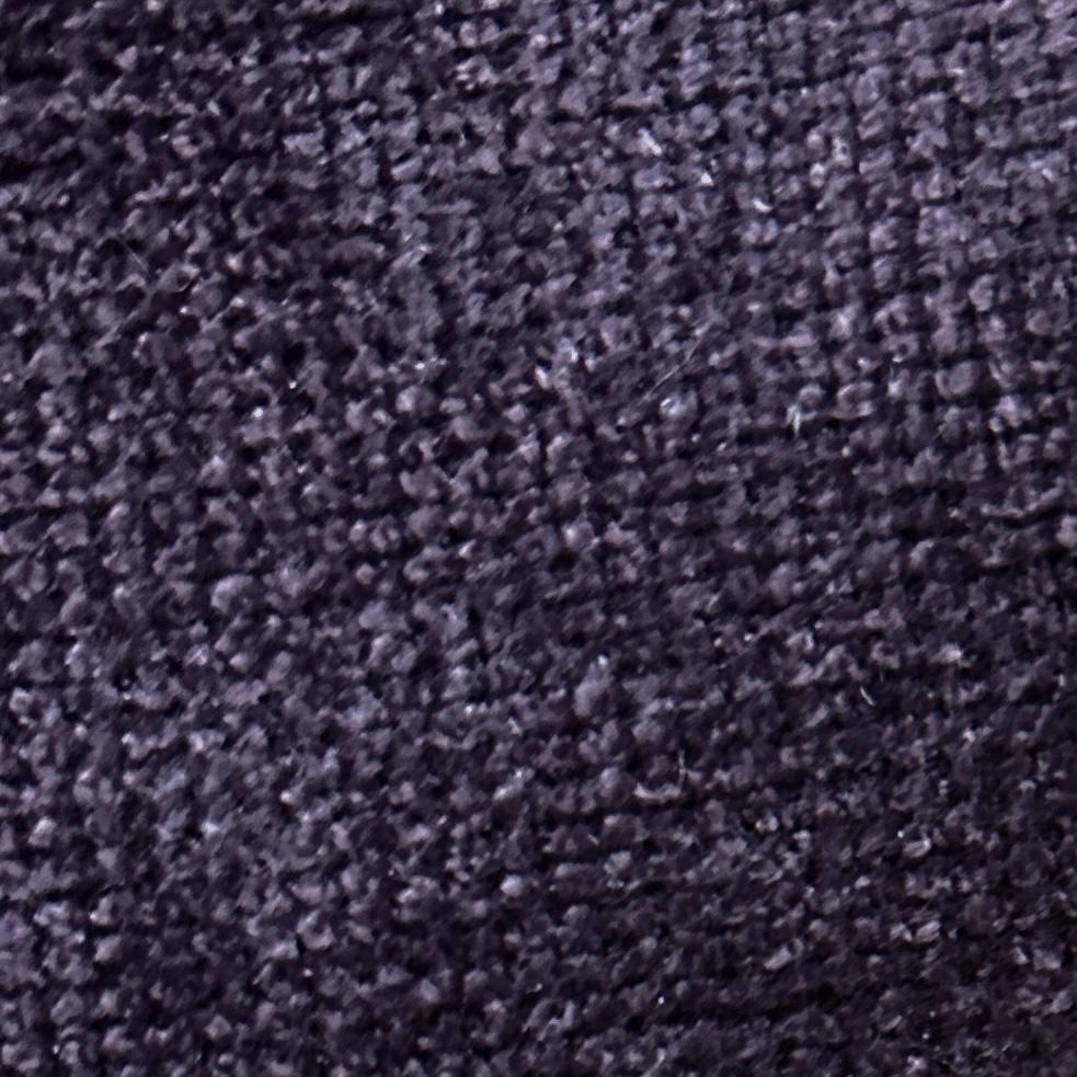 Solid purple textured velvet upholstery fabric with a soft surface and subtle tonal texture