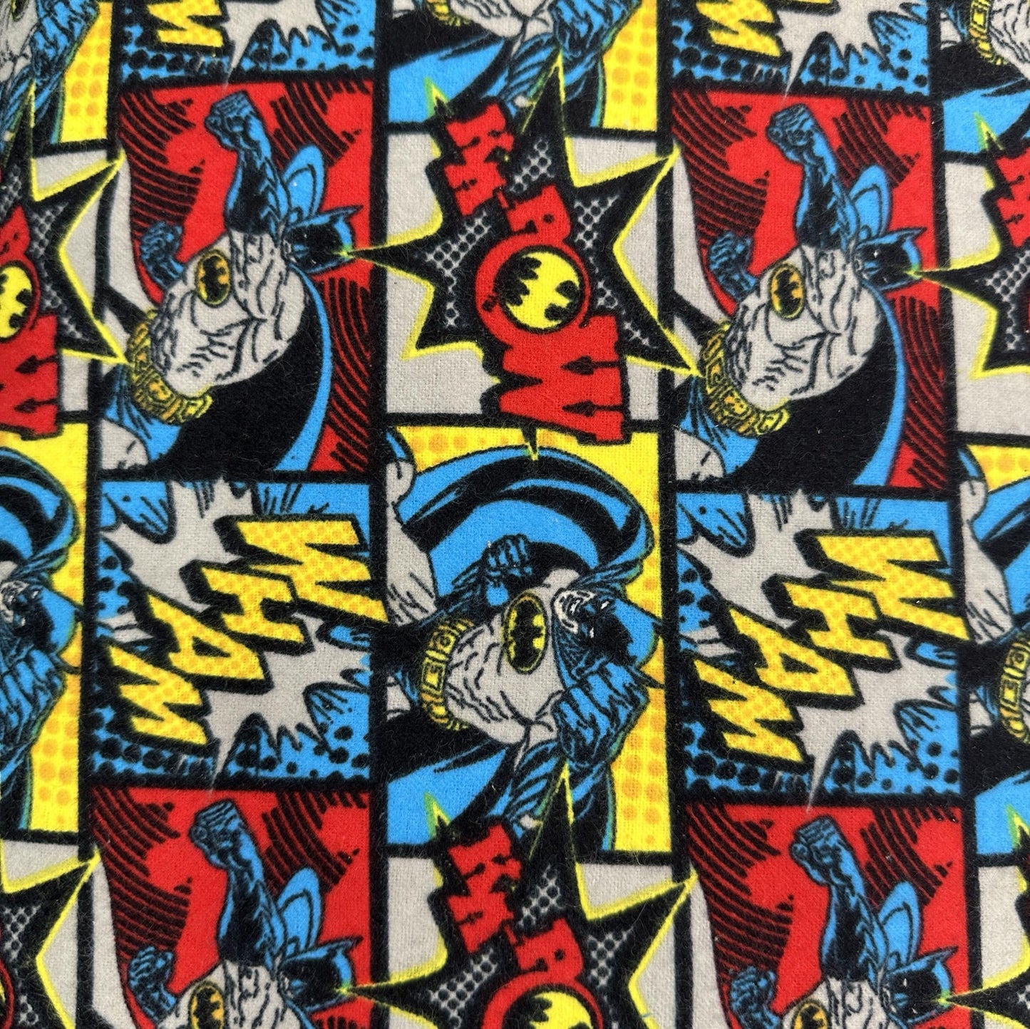 Batman comics flannel fabric with colourful grey, blue, red and yellow superhero panels