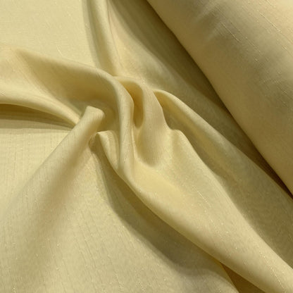 Gold wide-width sheer polyester drapery fabric with a textured finish