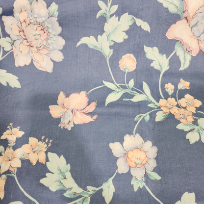 Beige floral 100% cotton fabric with a printed flower pattern and smooth woven texture