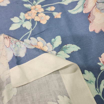 Beige floral 100% cotton fabric with a printed flower pattern and smooth woven texture