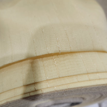 Gold wide-width sheer polyester drapery fabric with a textured finish