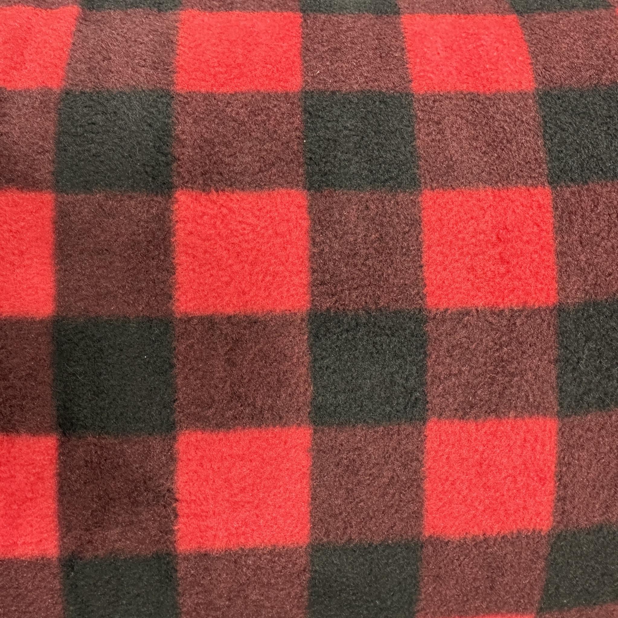 Red and black buffalo plaid polyester fleece fabric with a classic large check pattern